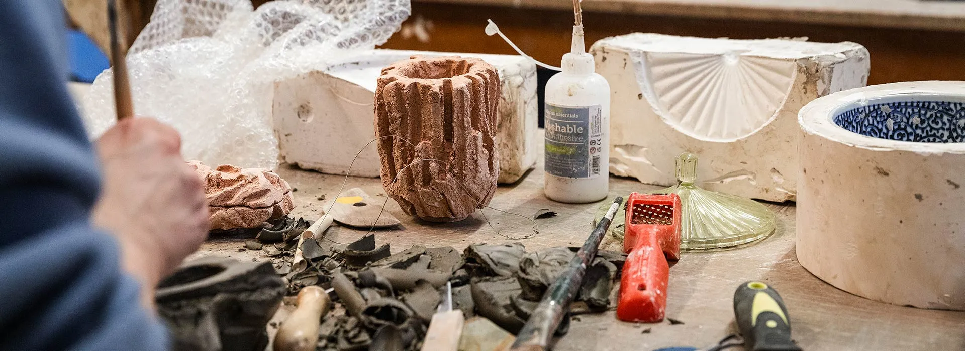 students learning how to use ceramic moulds