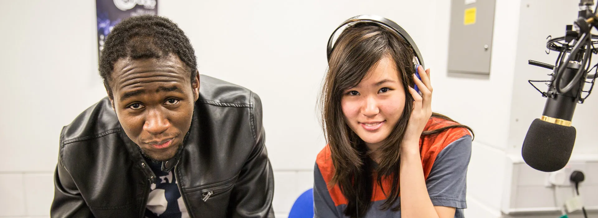 students smiling in the radio studio