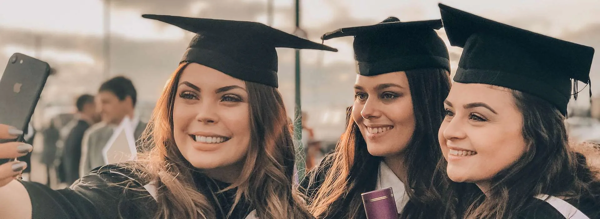 group of graduates in gowns and hats