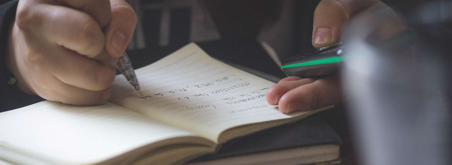 writing in notebook