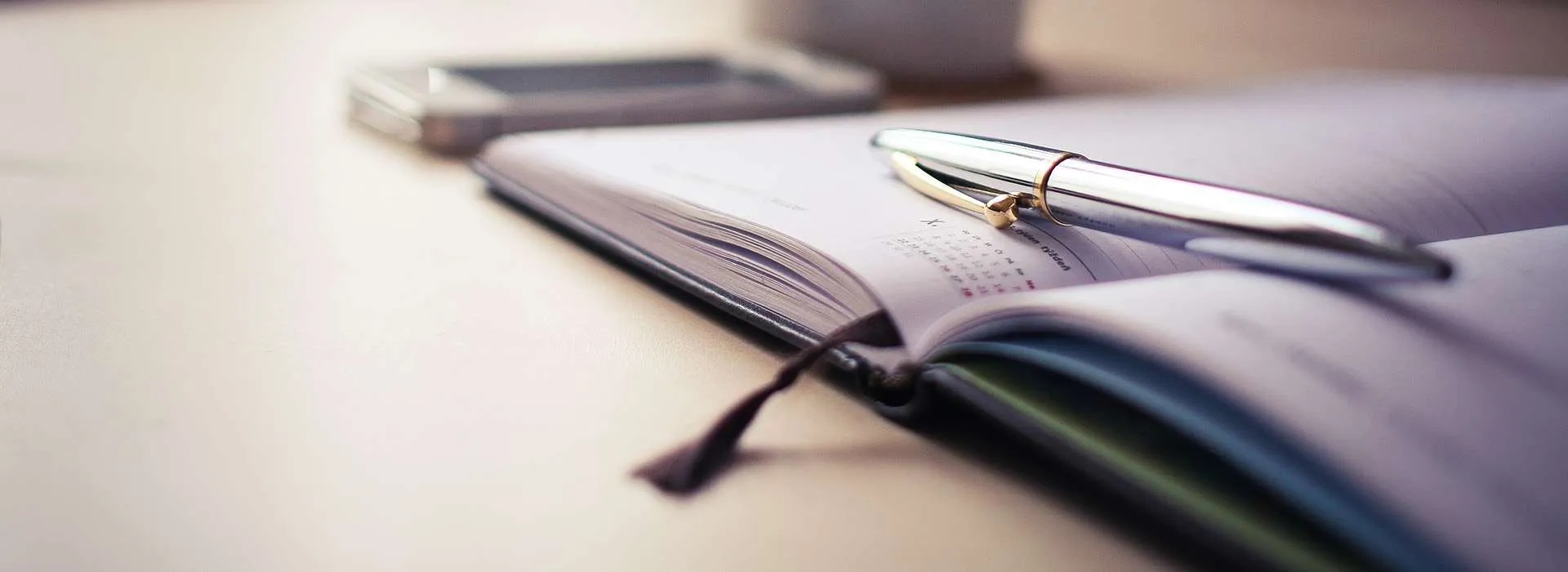 pen sitting on a notebook