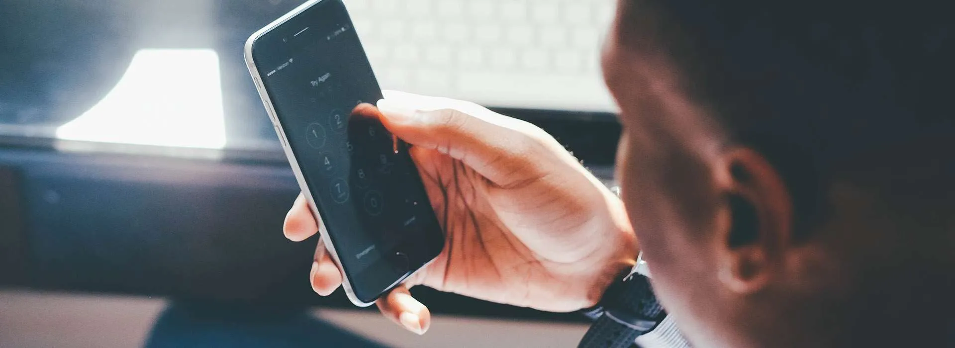 man looking at his mobile phone