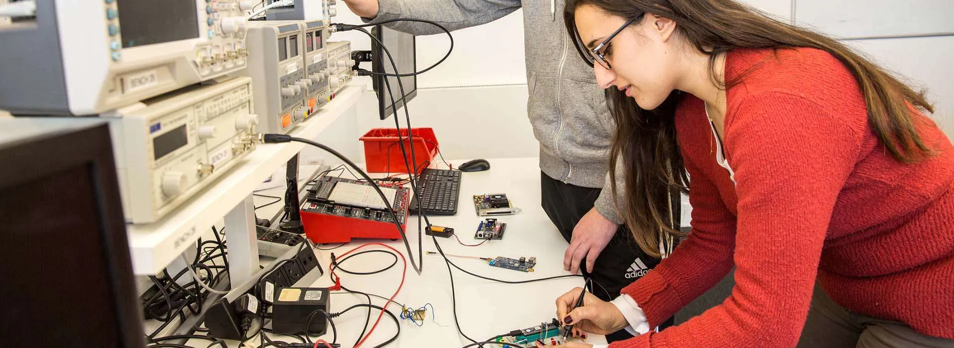 student using electronic engineering equipment