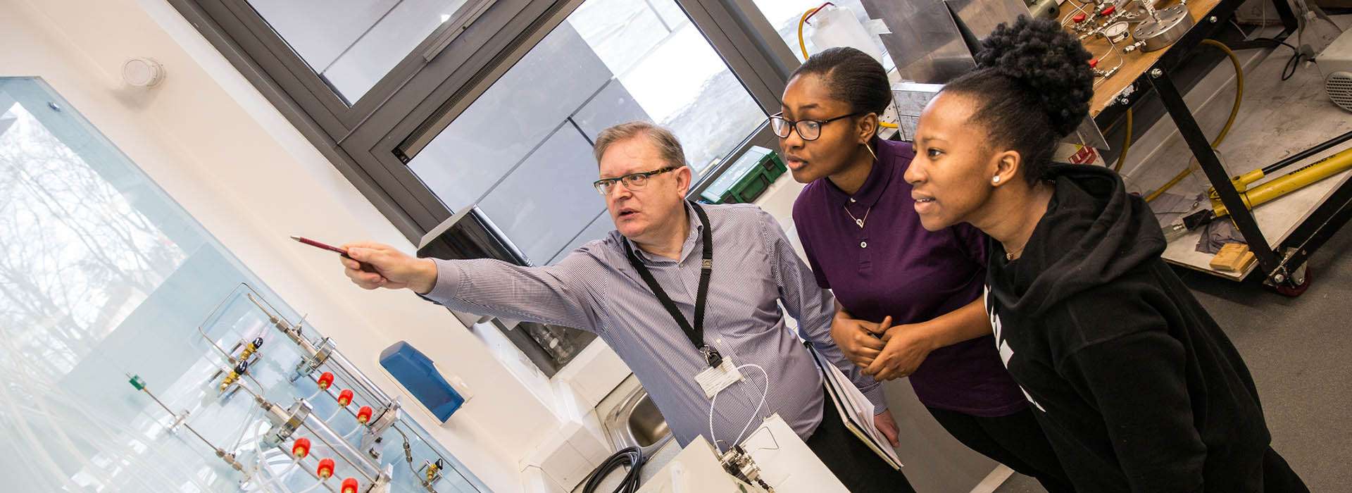 lecturer explaining engineering setup to students