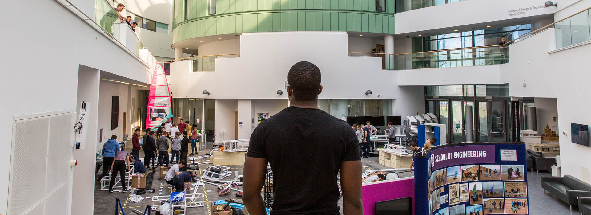 student standing looking at engineering projects on rgu campus