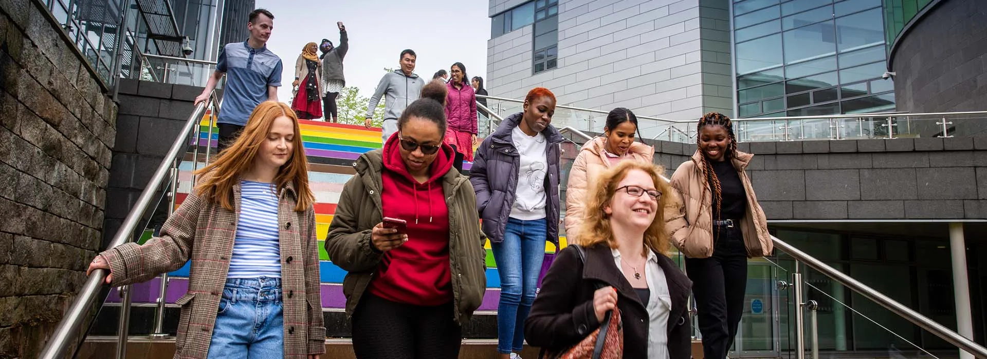 Students walking down the rainbow steps on campus