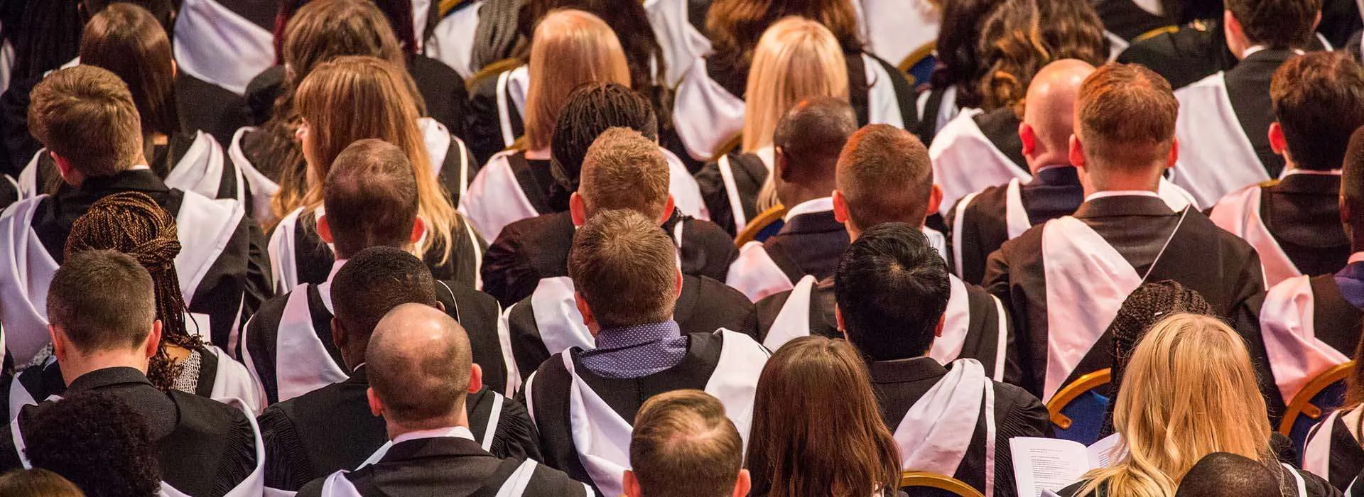 back of students heads at graduation