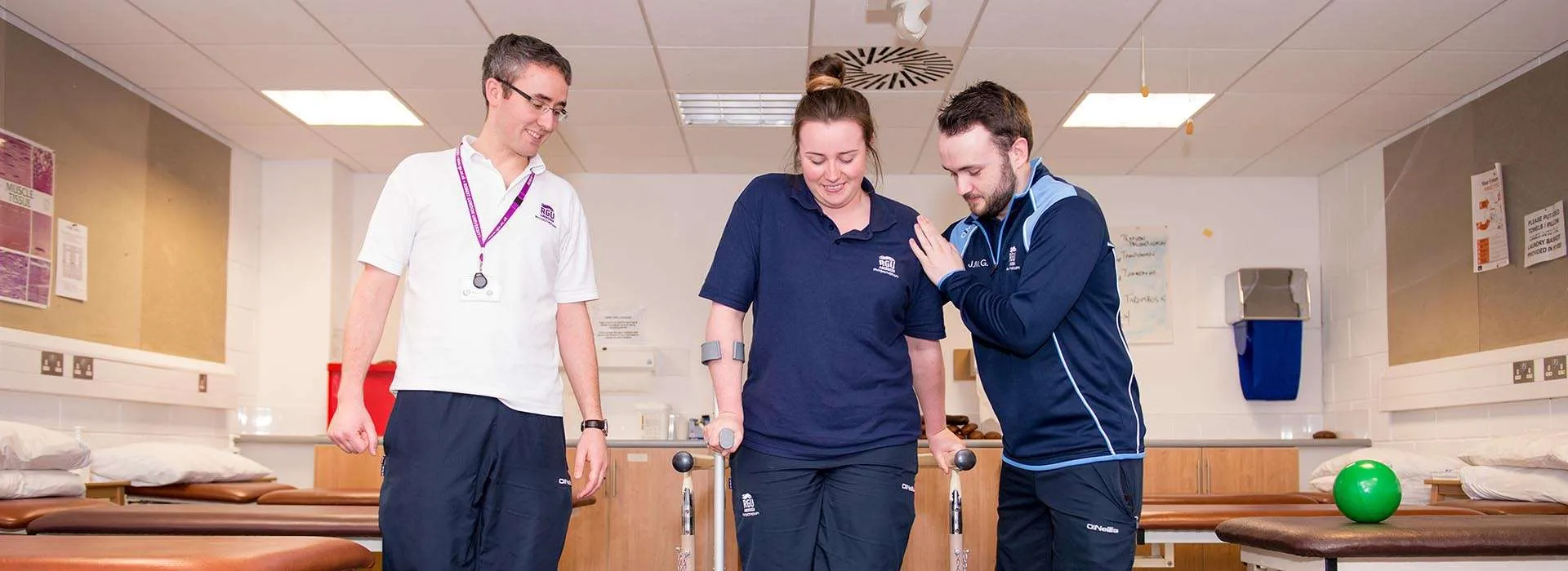 health professionals helping someone to walk