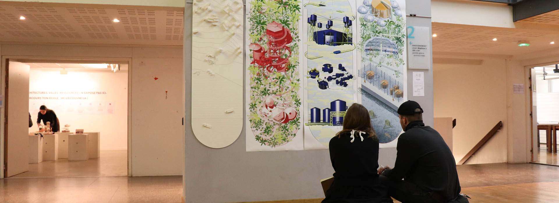 people sitting at an art exhibition