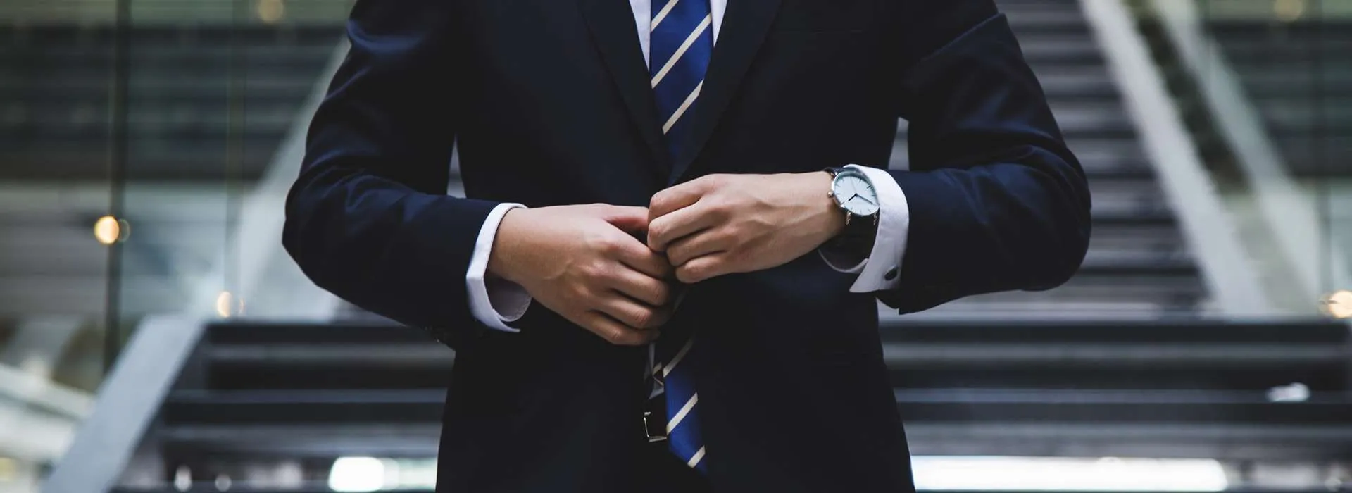 person adjusting their suit