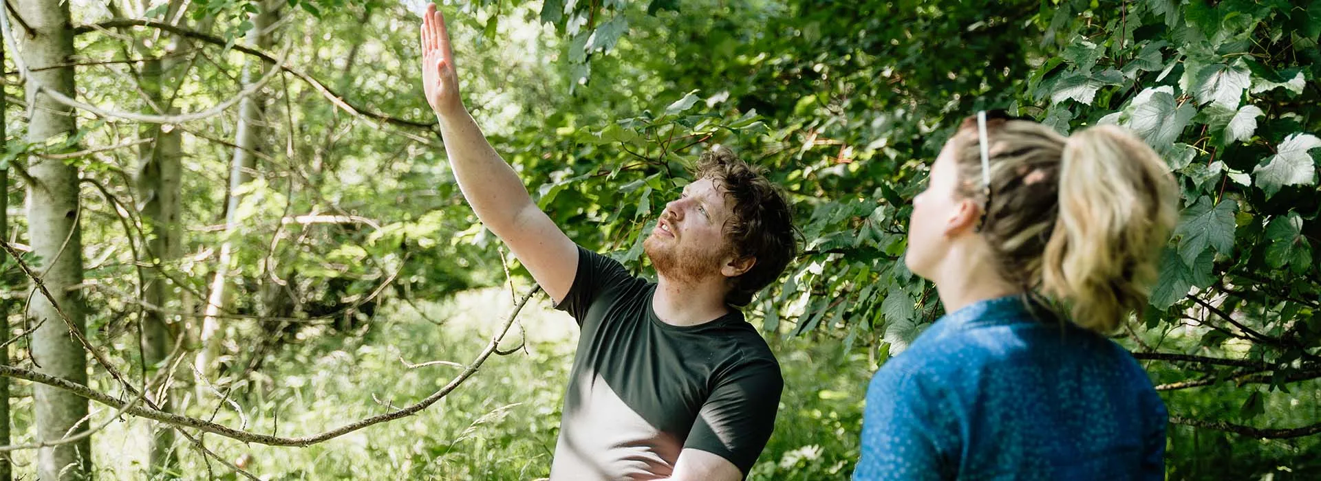 two staff members enjoying nature at waterside farm