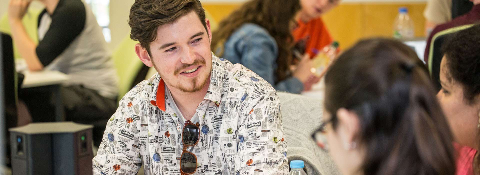 students smiling together in classroom