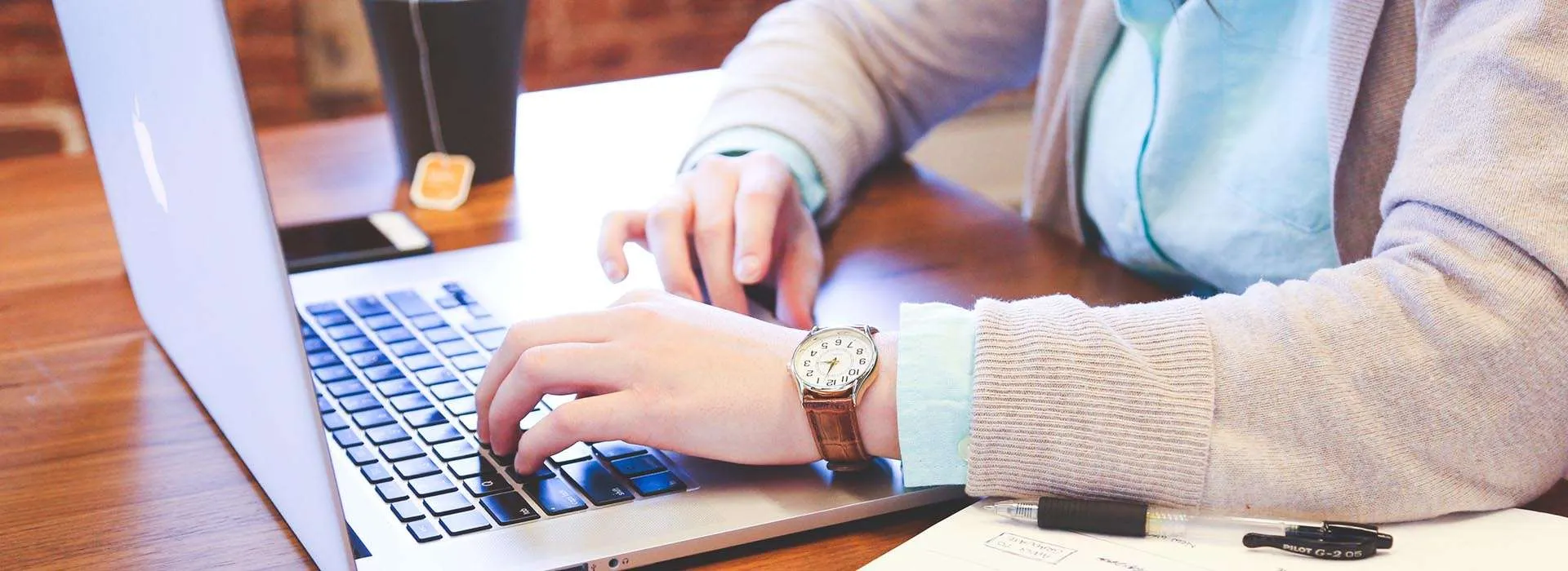 person typing on laptop