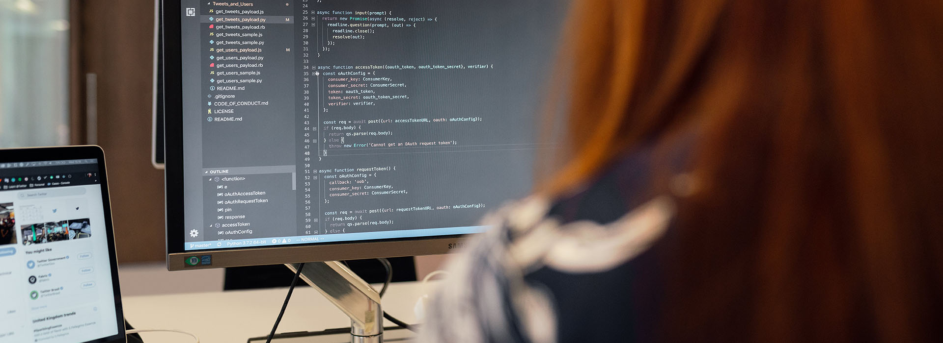 person writing code on a computer