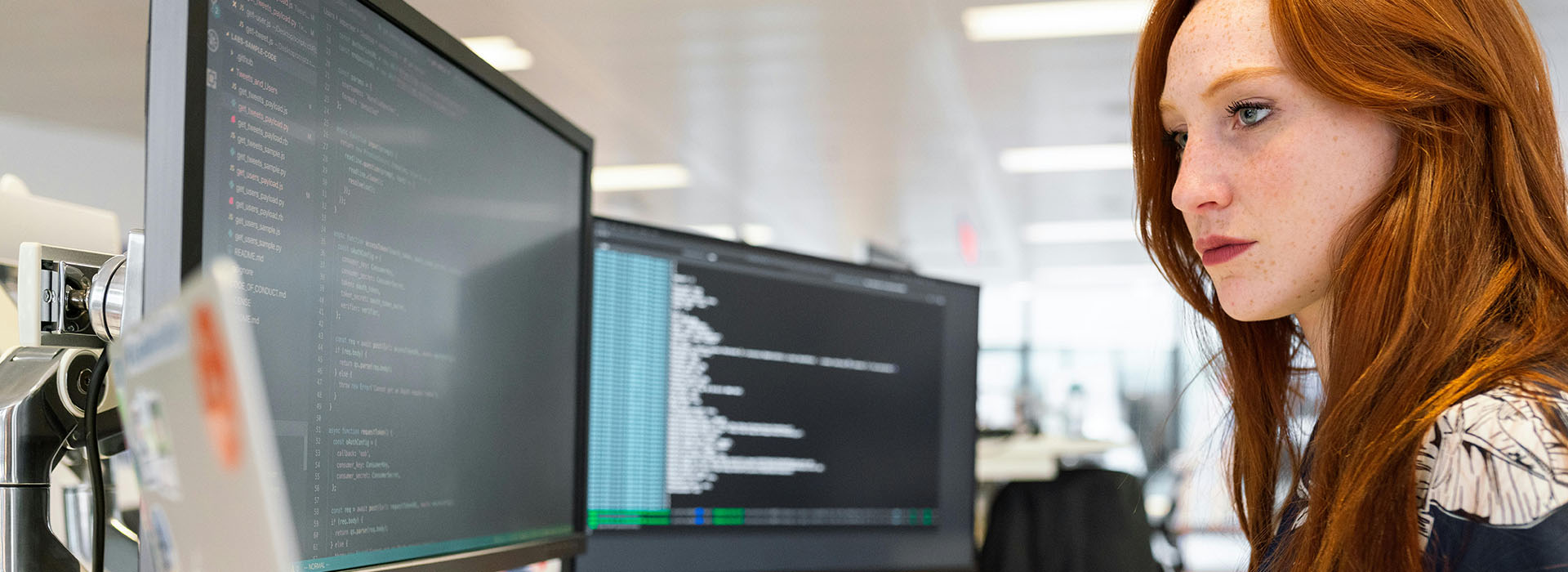person looking at a screen with code