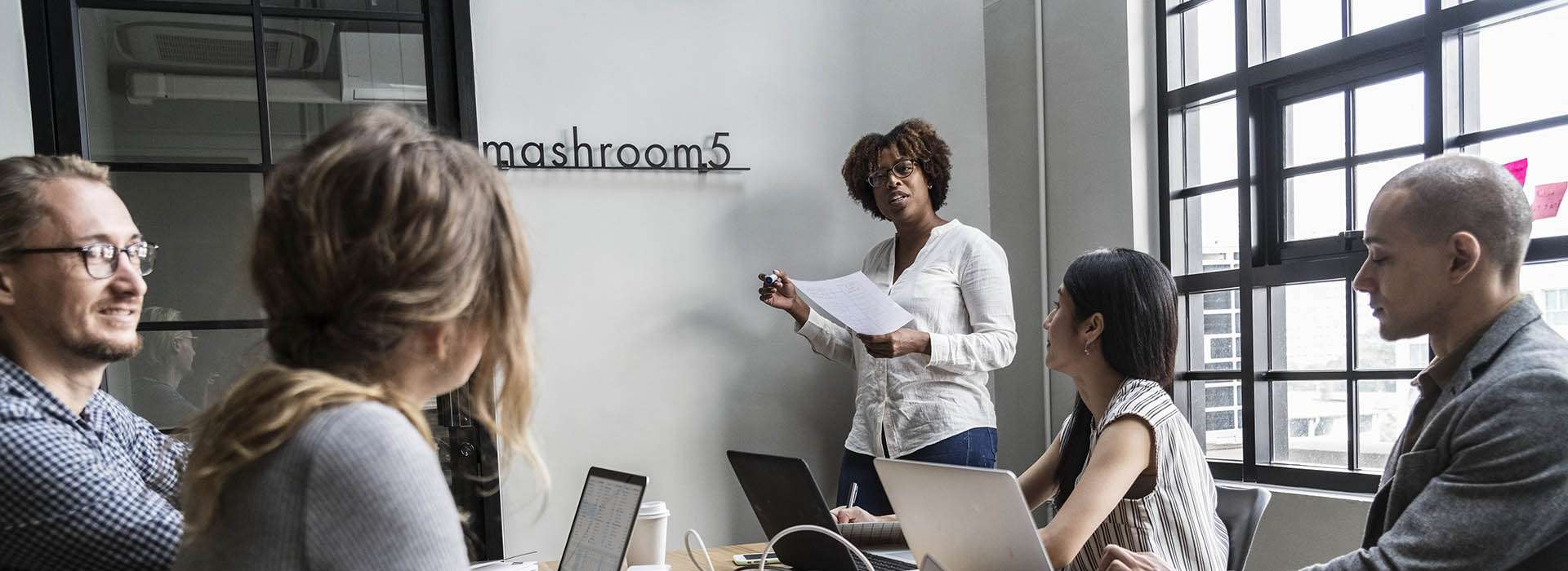 people having a meeting with laptops on the table people having a meeting with laptops on the table