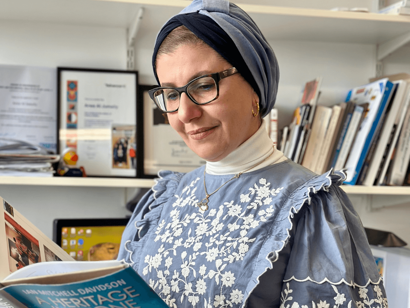 RGU lecturer reading book in office