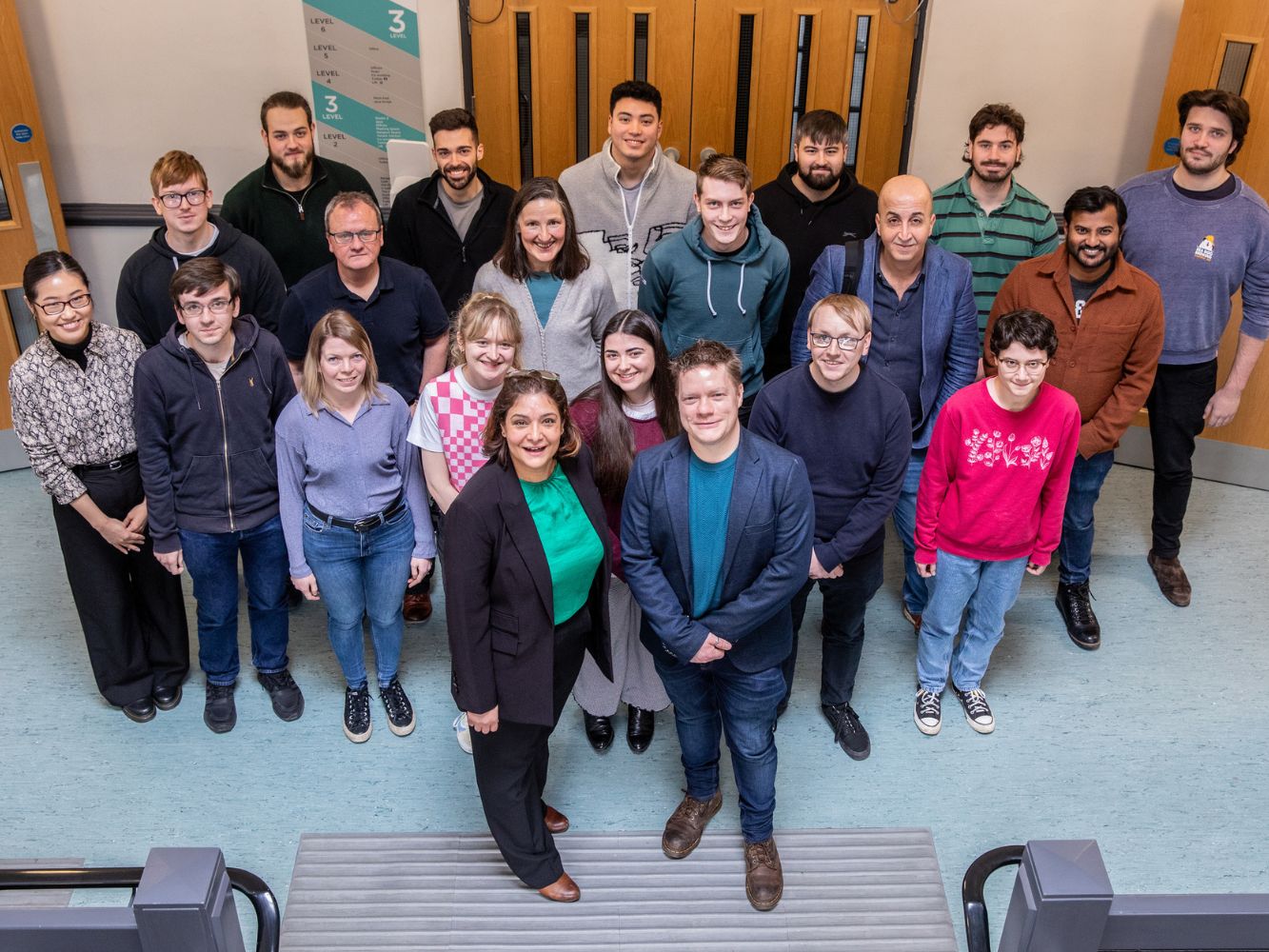 Nassima Brown, Director of Strategy at Fennex and John Isaacs, Dean of the School of Computing, with staff from both RGU and Fennex.