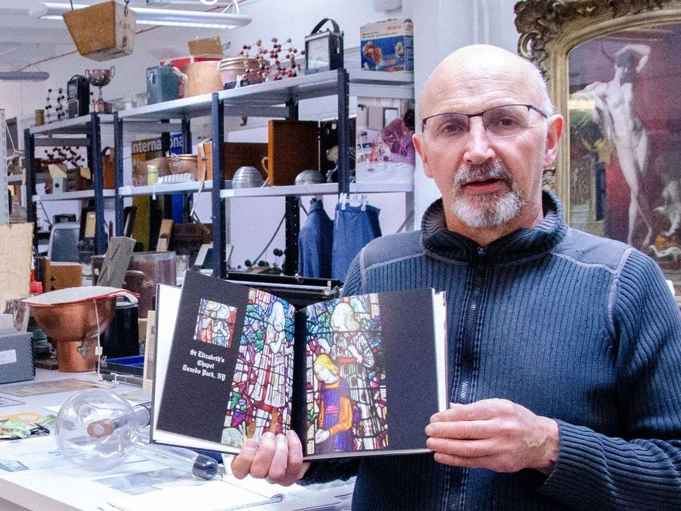 George Cheyne from RGU Art and Heritage Collection with book from Gray's alumnus, Henry Wynd Young