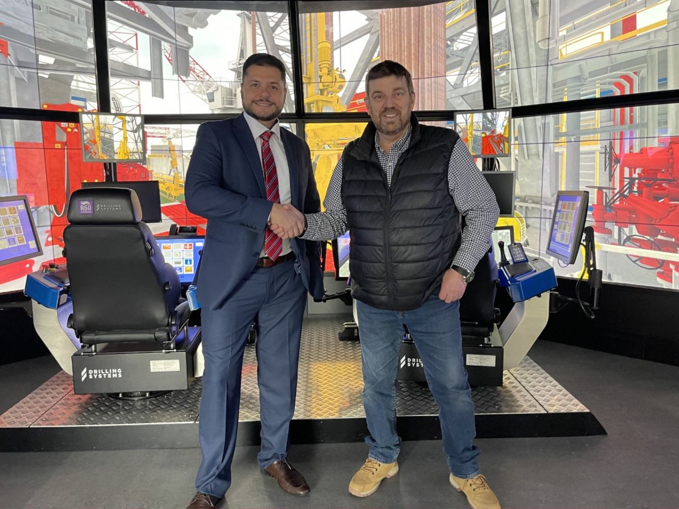 Paulo Morirz, director of operations ICM Group and Professor Phil Hassard, RGU’s drilling simulator manager with DART in the background.