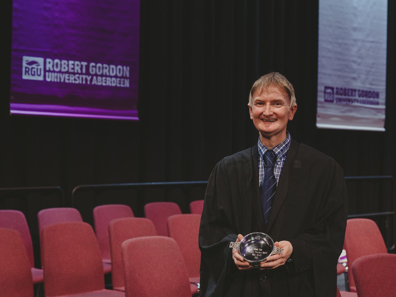 Mike Melvin receiving his award