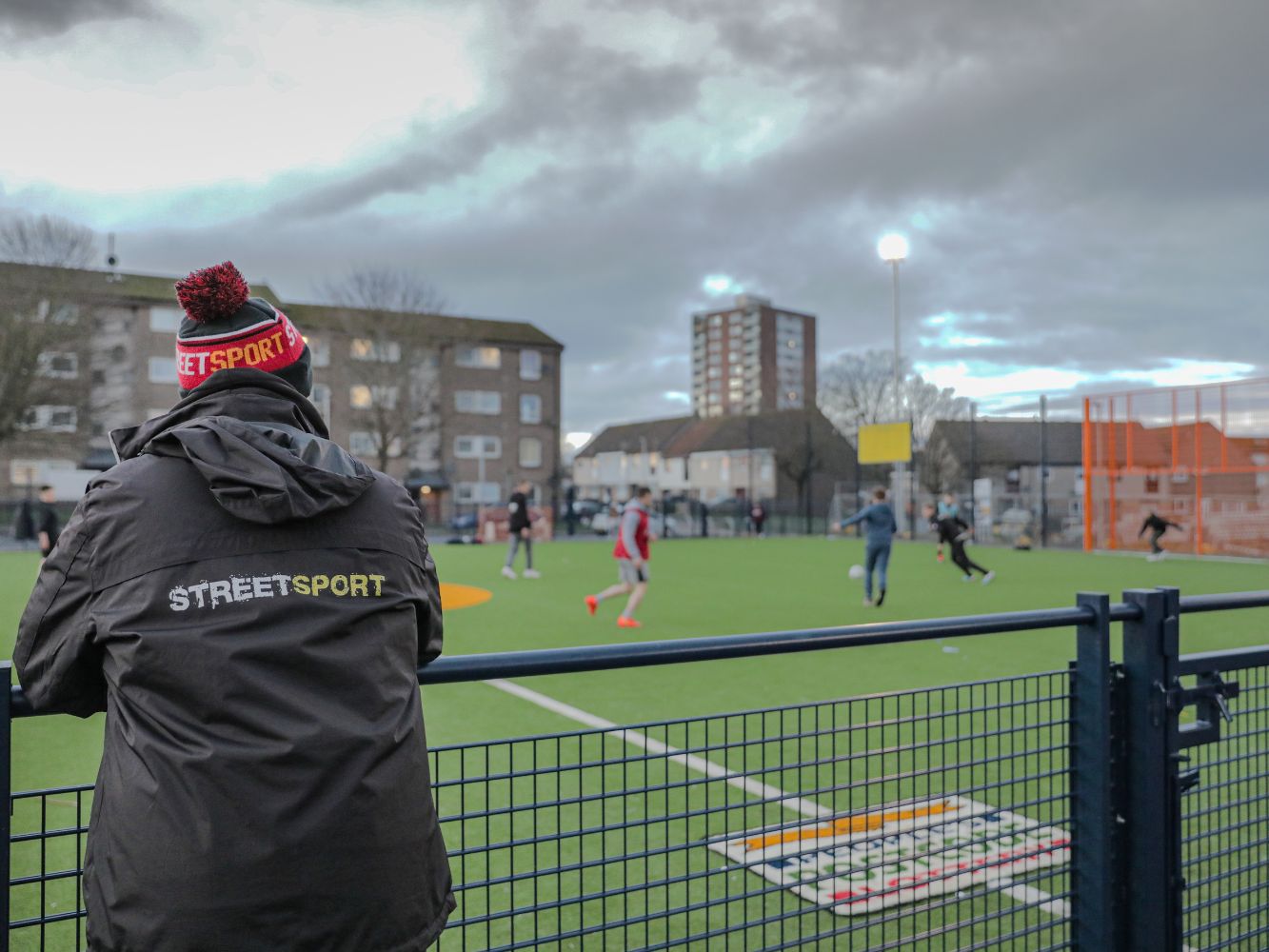 A Streetsport volunteer looks upon a session at Cruyff Court Willie Miller