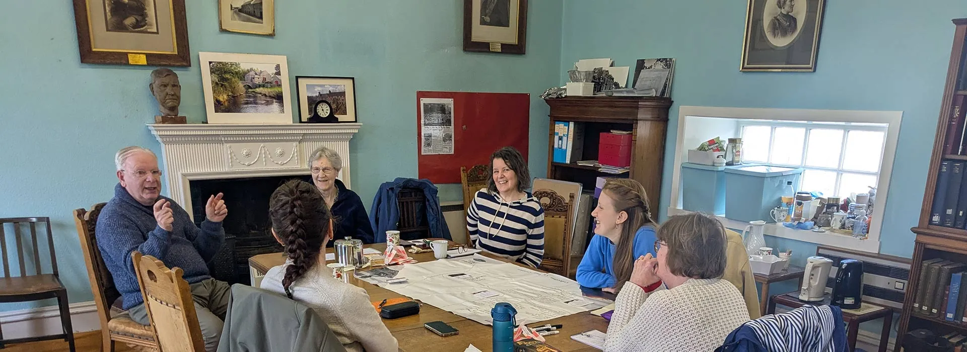 group of people sitting around a table