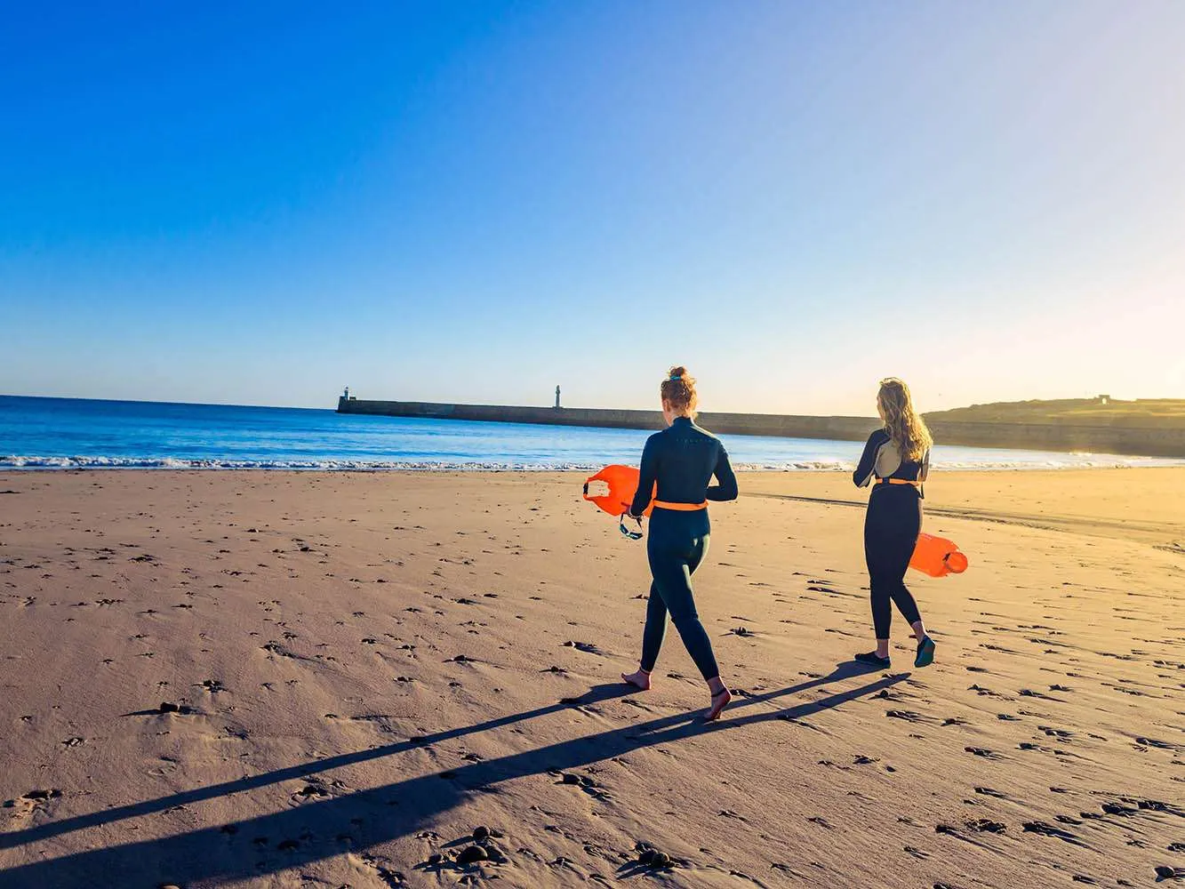 Two wild swimmers on Aberdeen beach