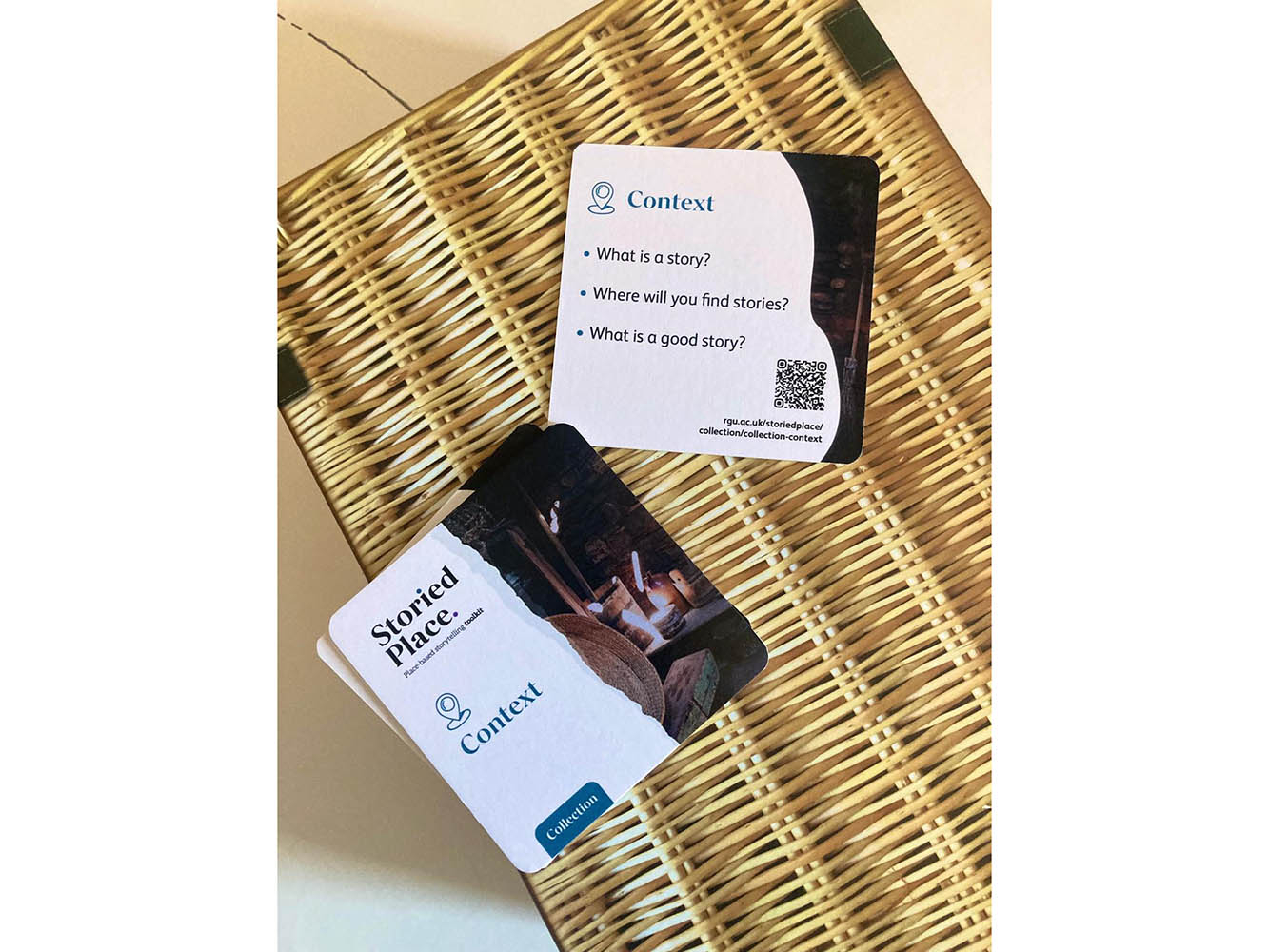 Three square coasters placed on a brown picnic hamper box