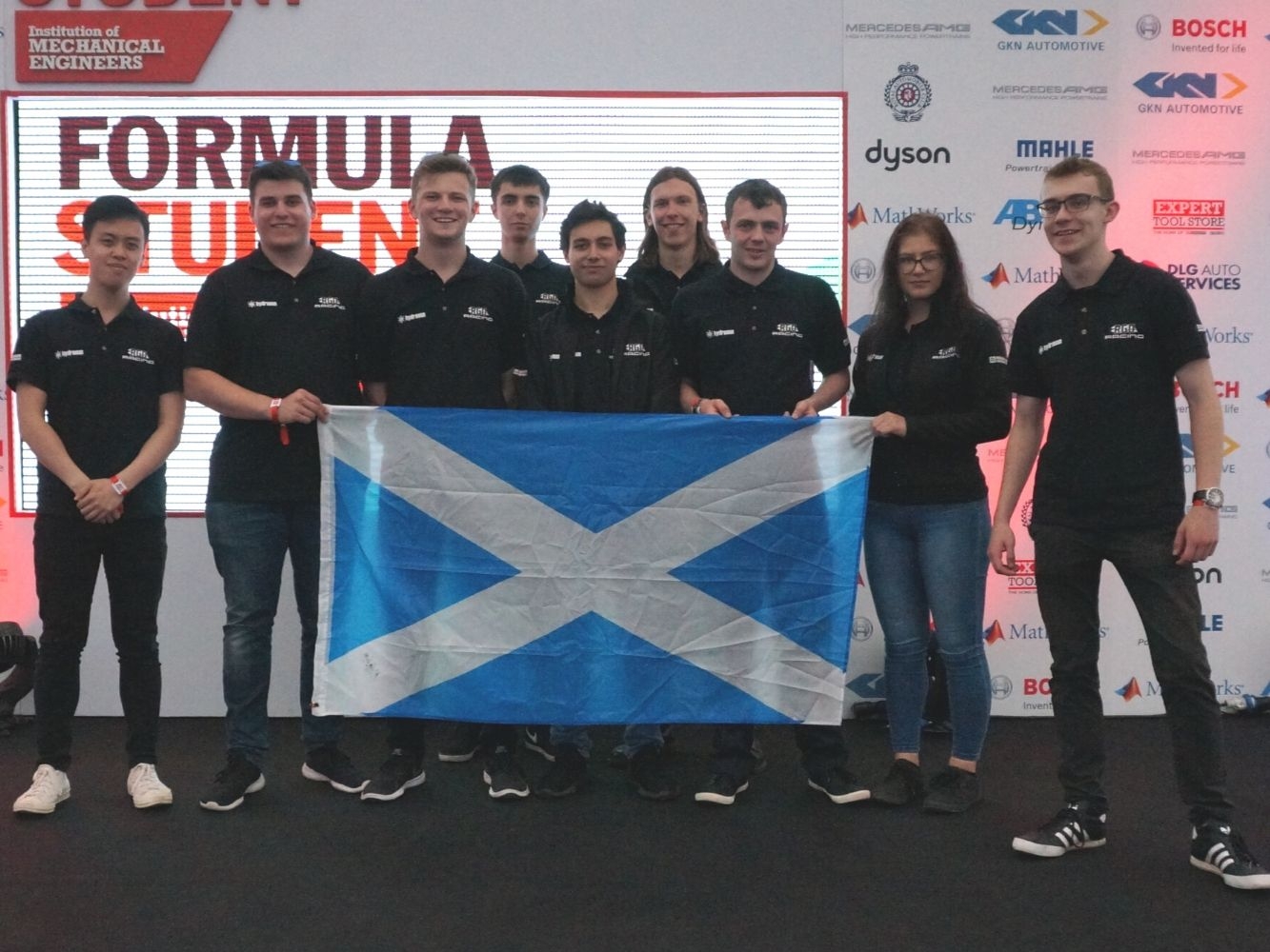 Group of students holding Scottish flag