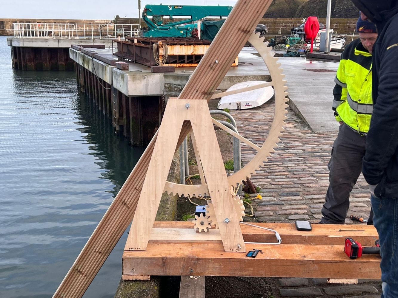 A wooden piece of architecture being tested in a North East harbour