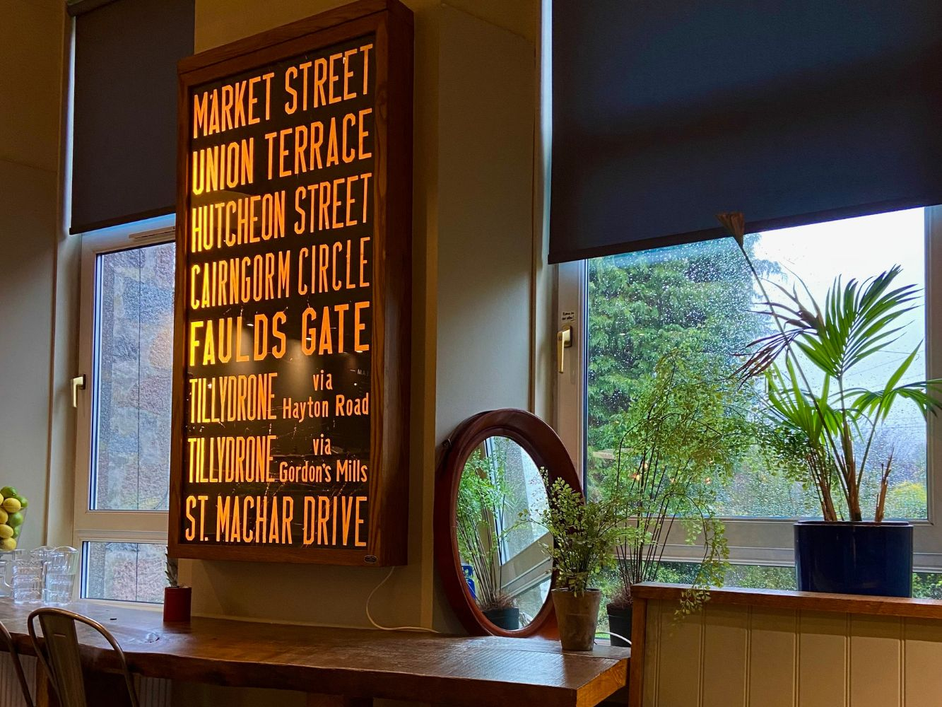 A restaurant set out with tables and an old Aberdeen bus sign