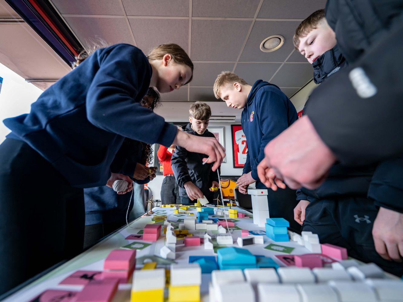 School pupils participate in the activity that includes a small model city