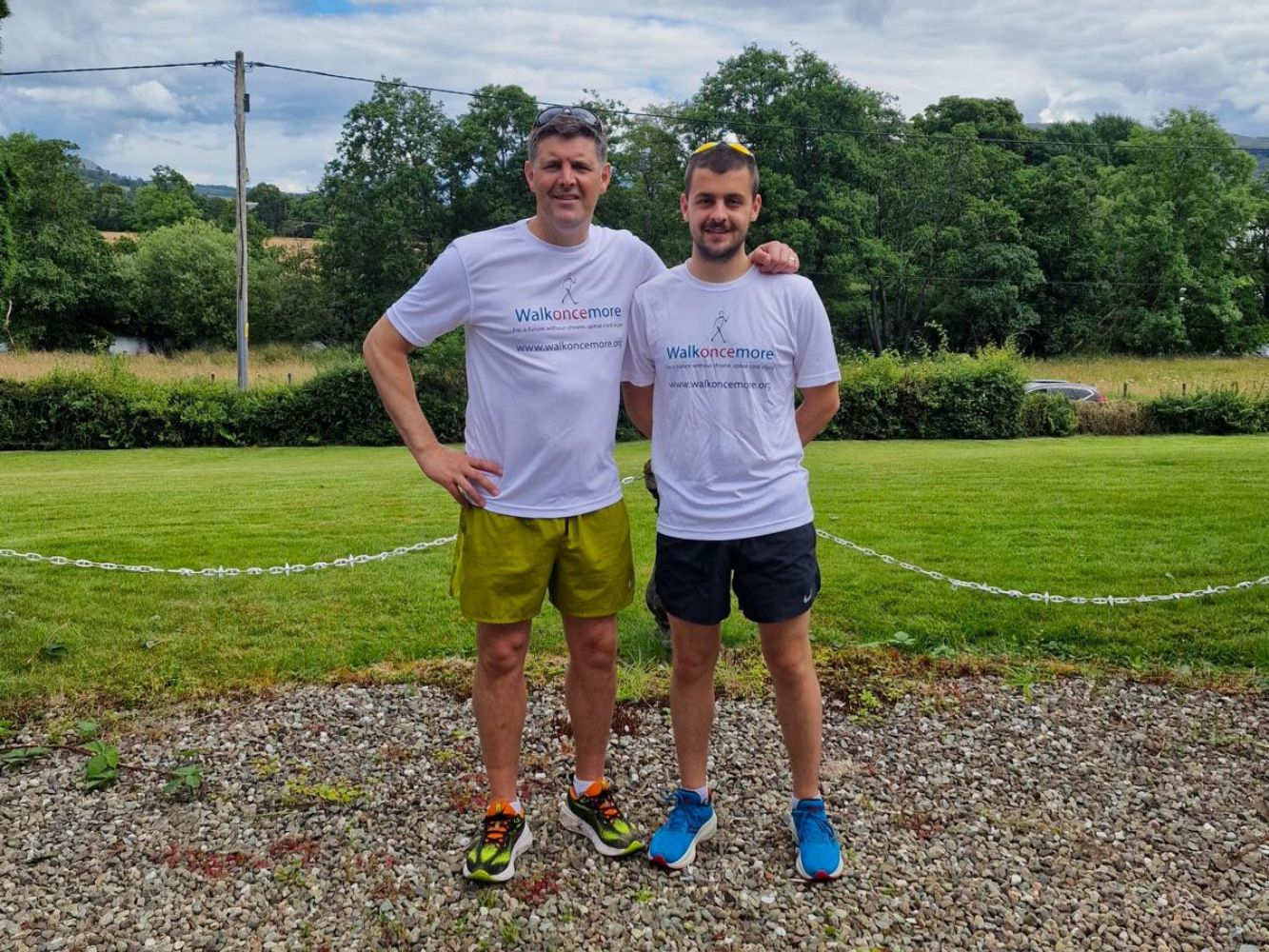 Jayden and Bronson stand together wearing Walkoncemore charity tshirts