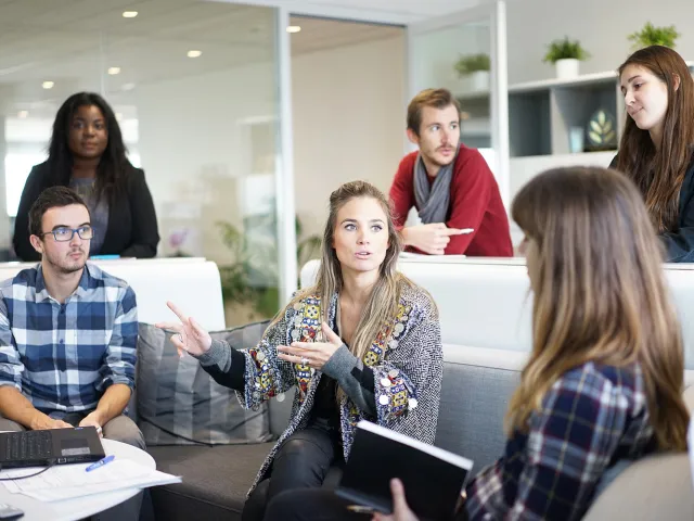 students chatting in a modern building