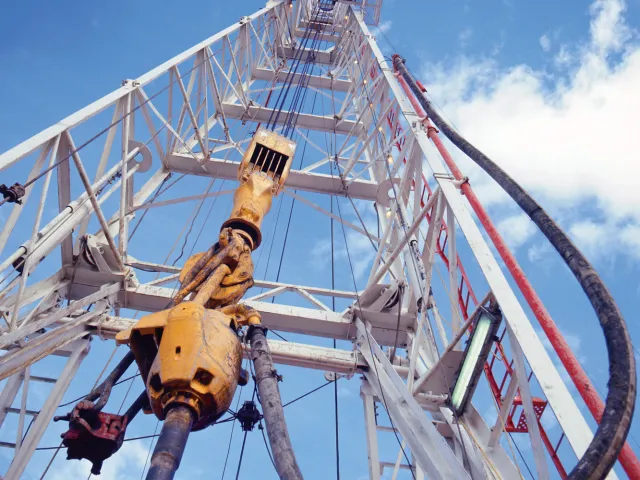 structure holding a well drilling rig