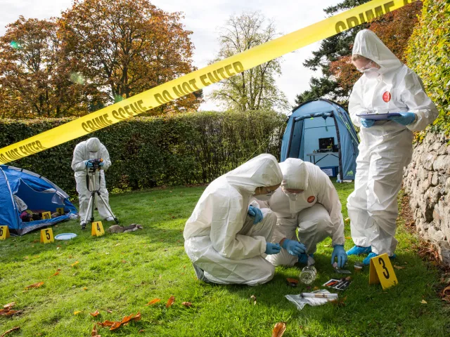 Students at an outdoors Mock Crime Scene