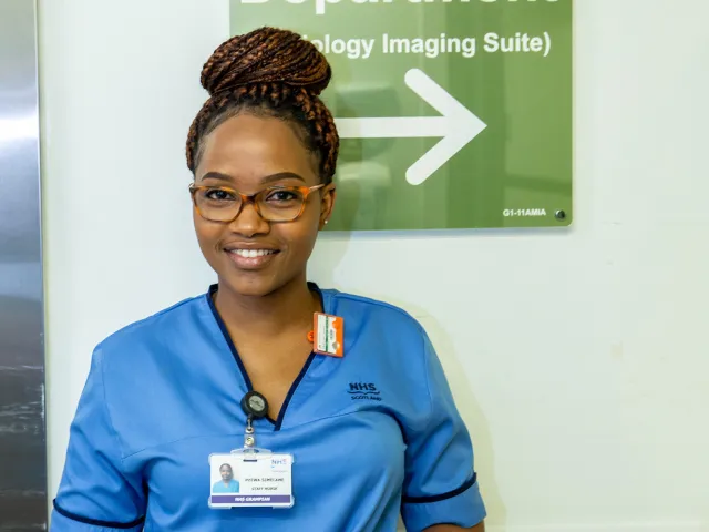 woman in scrubs with stethoscope