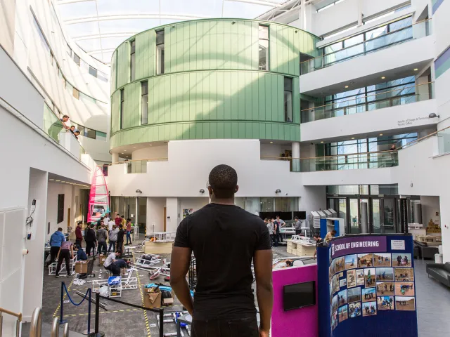 student standing looking at engineering projects on rgu campus