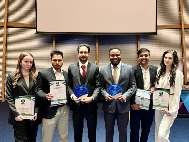 The winning team and our two Student Presidents holding their awards and certificates