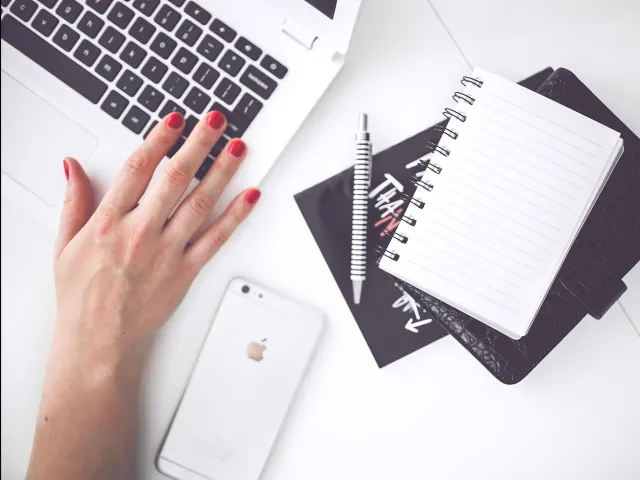 desk with laptop, notebook and mobile phone
