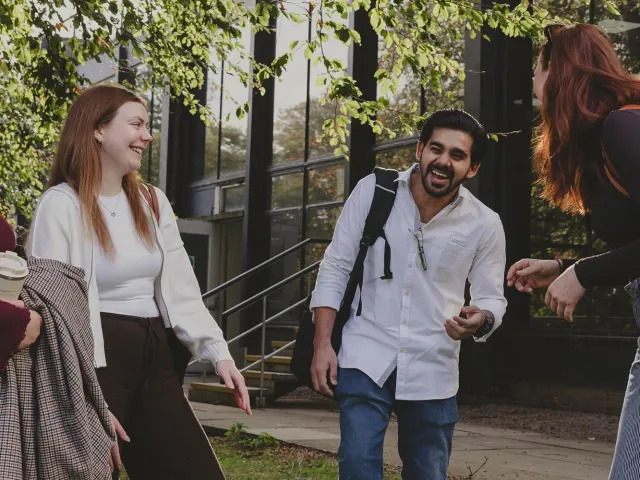 Students on campus laughing