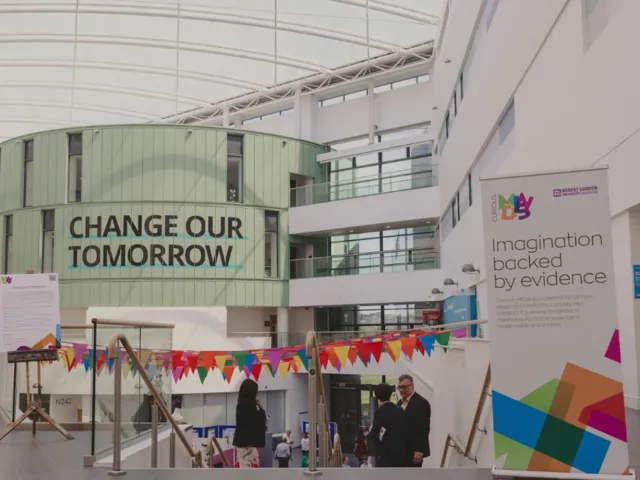 multicoloured flags in sir ian wood building, rgu