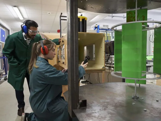 student constructing something out of wood