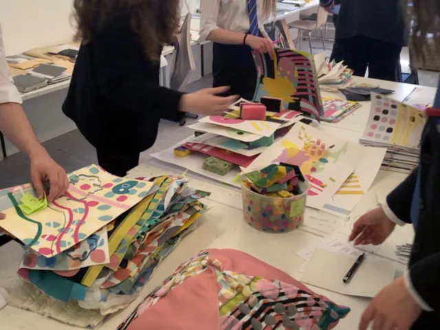 people looking through piles of paper
