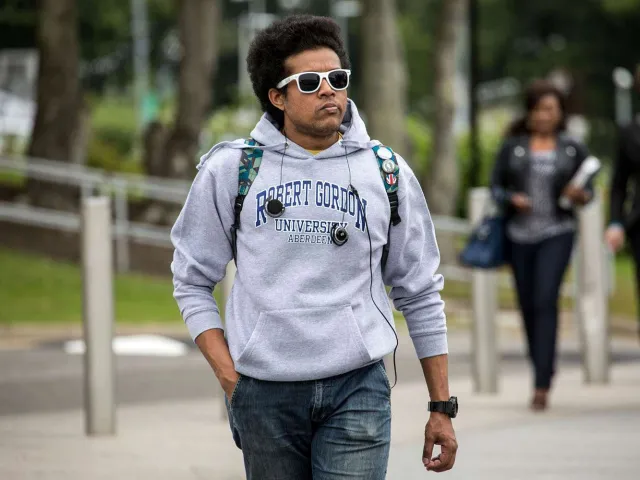 student with RGU hoodie on
