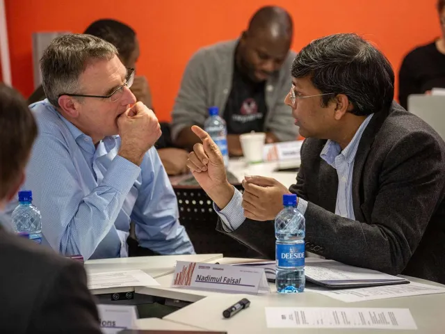 two people in suits having an in depth discussion