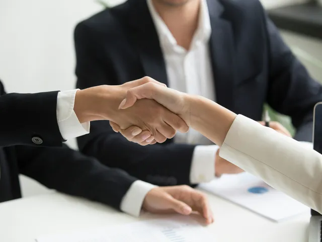 two people shaking hands