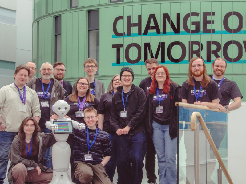Staff from the School of Computing, Engineering and Technology with Pepper the robot