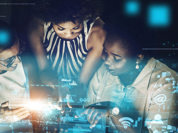 women looking at a digital screen women looking at a digital screen